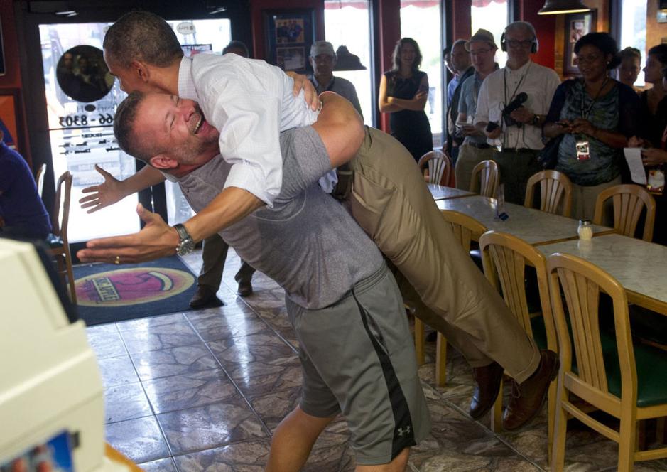 Obama raised in hug by restaurant owner